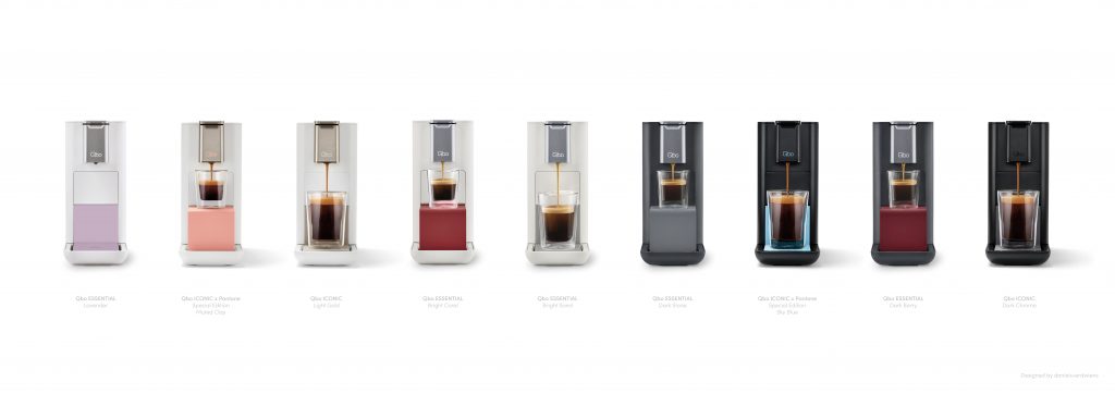 Various Qbo coffee machines in different colors, arranged in a row.